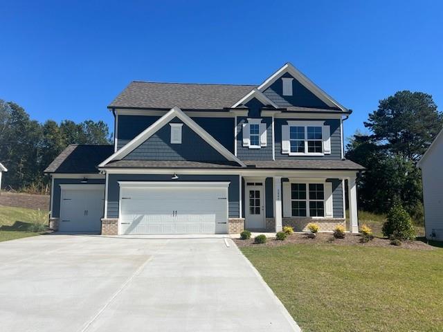 a front view of a house with yard porch and outdoor seating