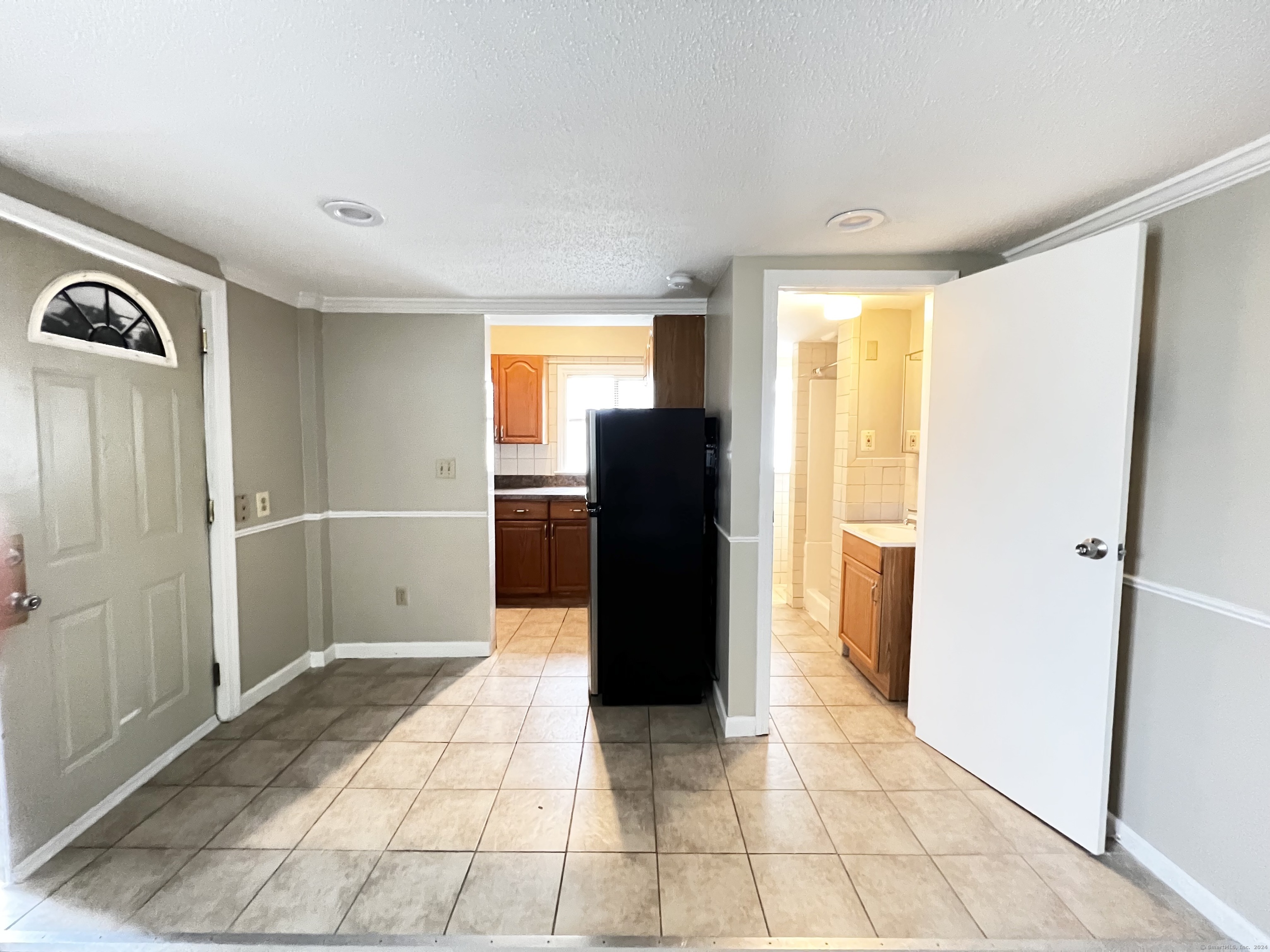 a view of a utility room with closet and a window