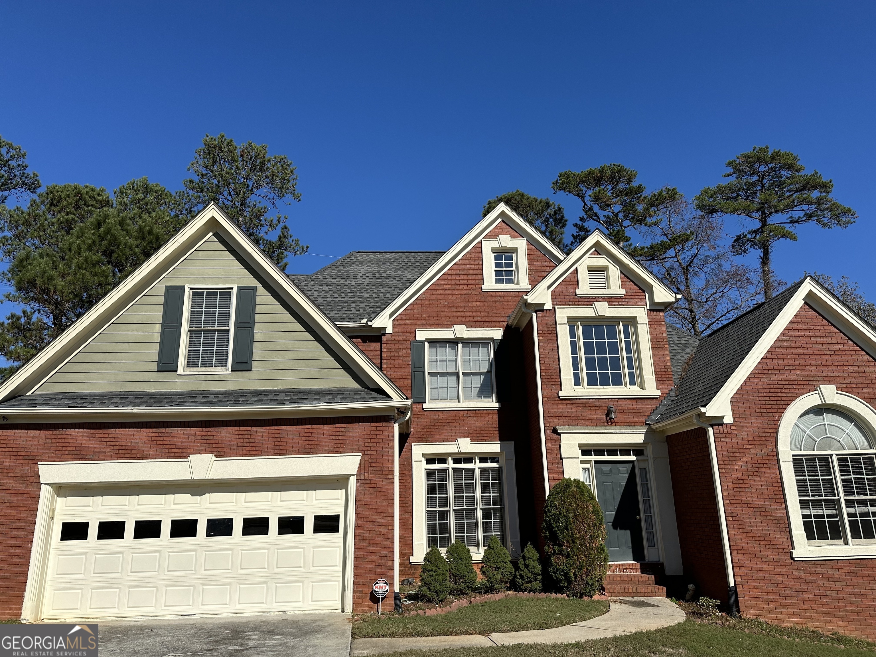 a front view of a house with a yard