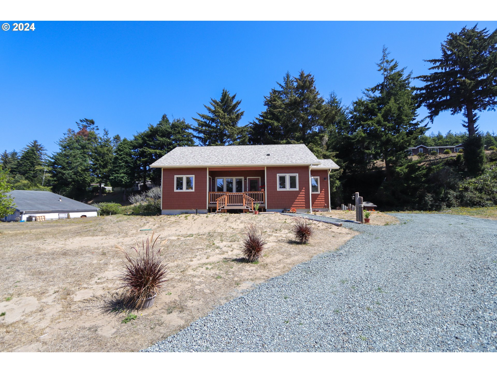 a front view of a house with a yard