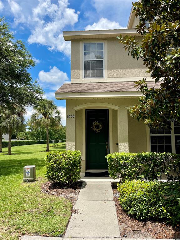 front view of a house with a yard