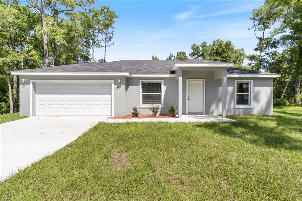 front view of a house with a yard