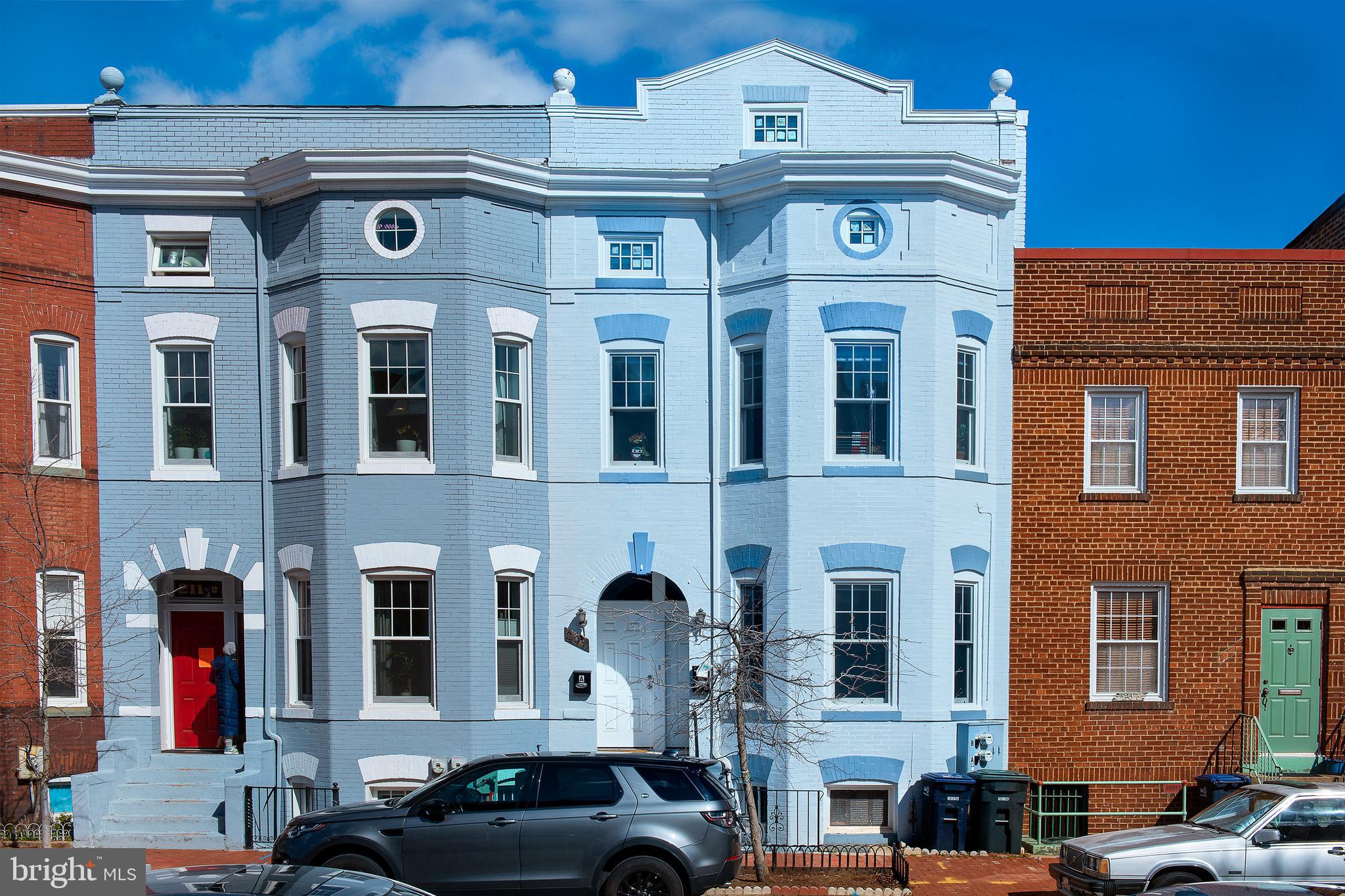 a front view of a building with multiple windows