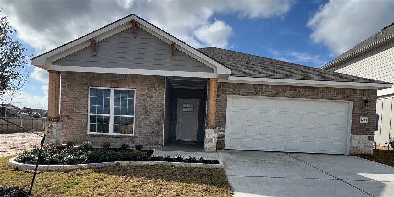 View of front of house featuring a garage and a fr