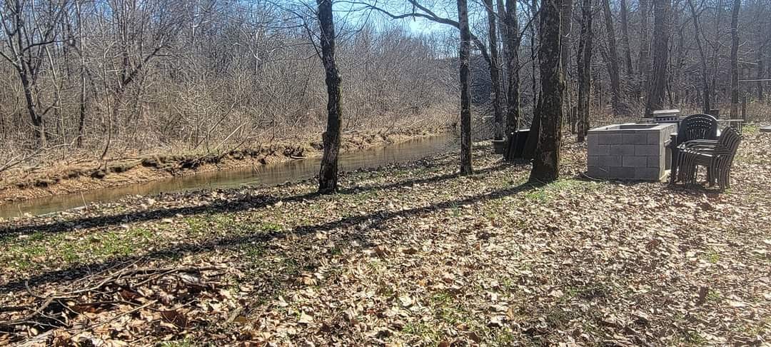 a view of a backyard of the house