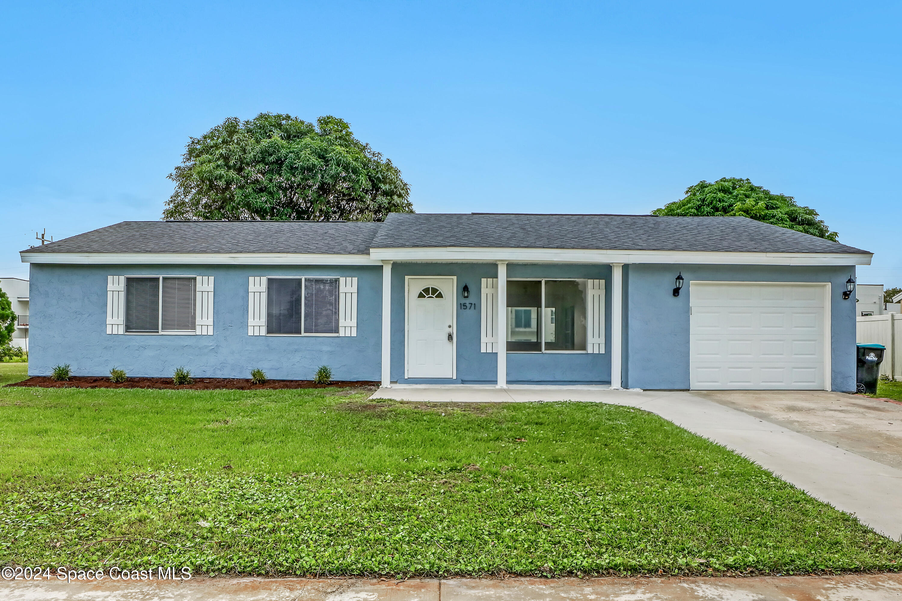 front view of a house with a yard