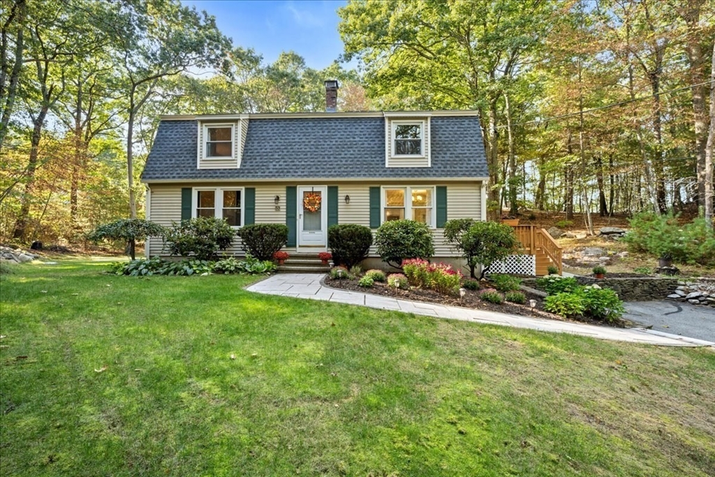 front view of a house with a yard