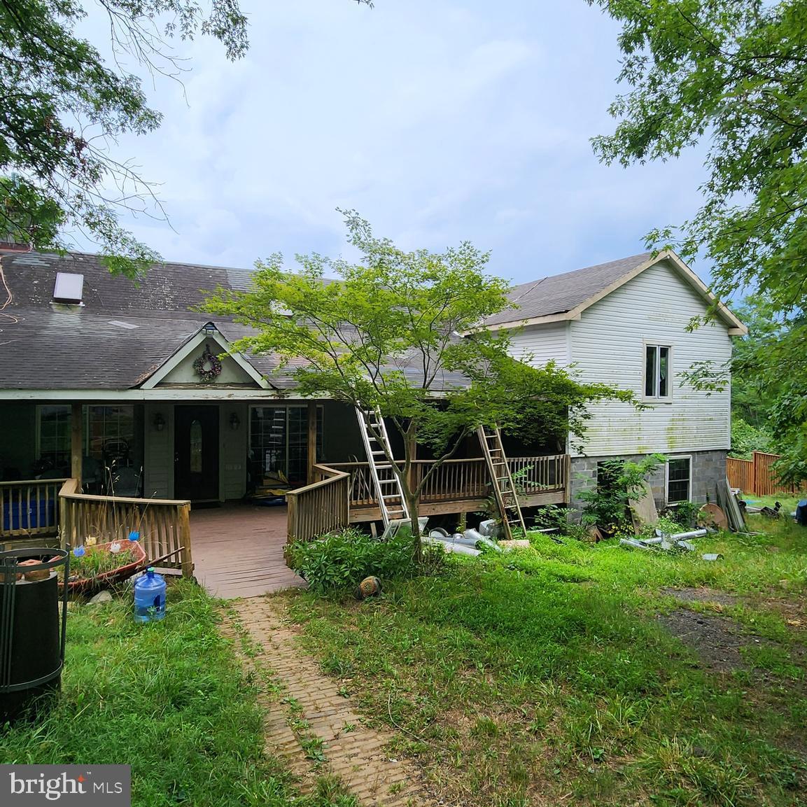 a view of a house with a backyard porch and sitting area