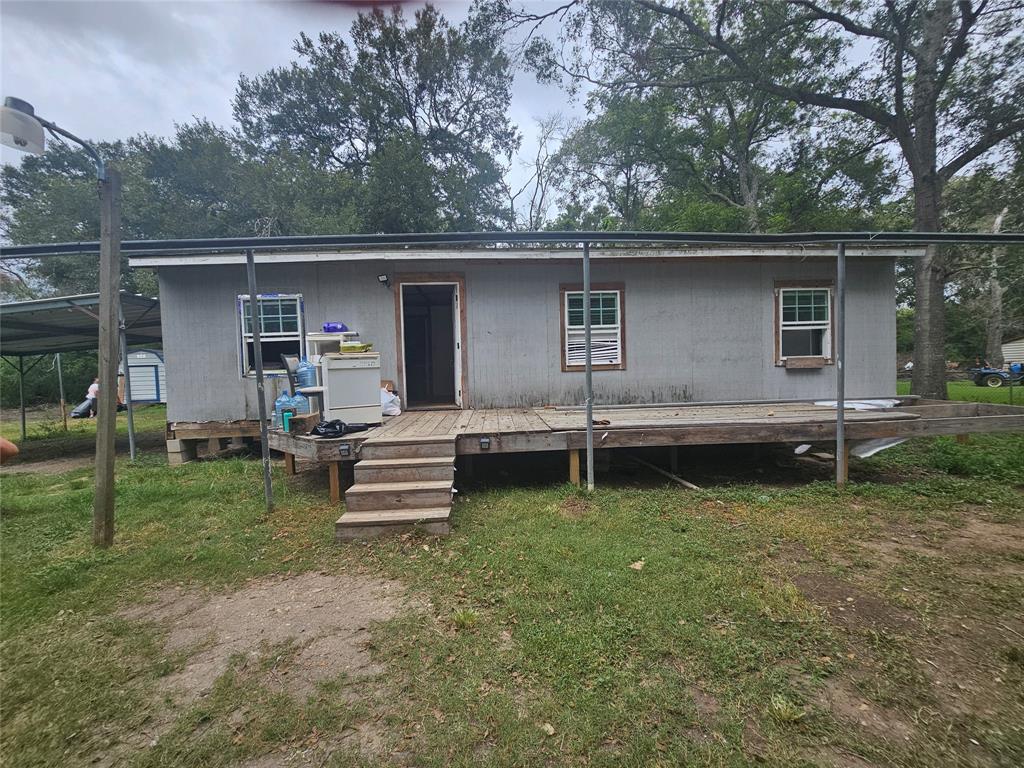 a backyard of a house with yard and barbeque oven