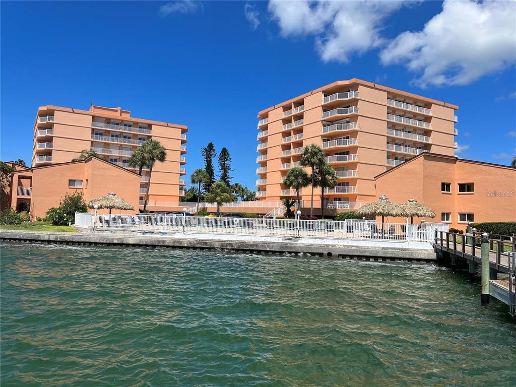 a view of a large building with a swimming pool