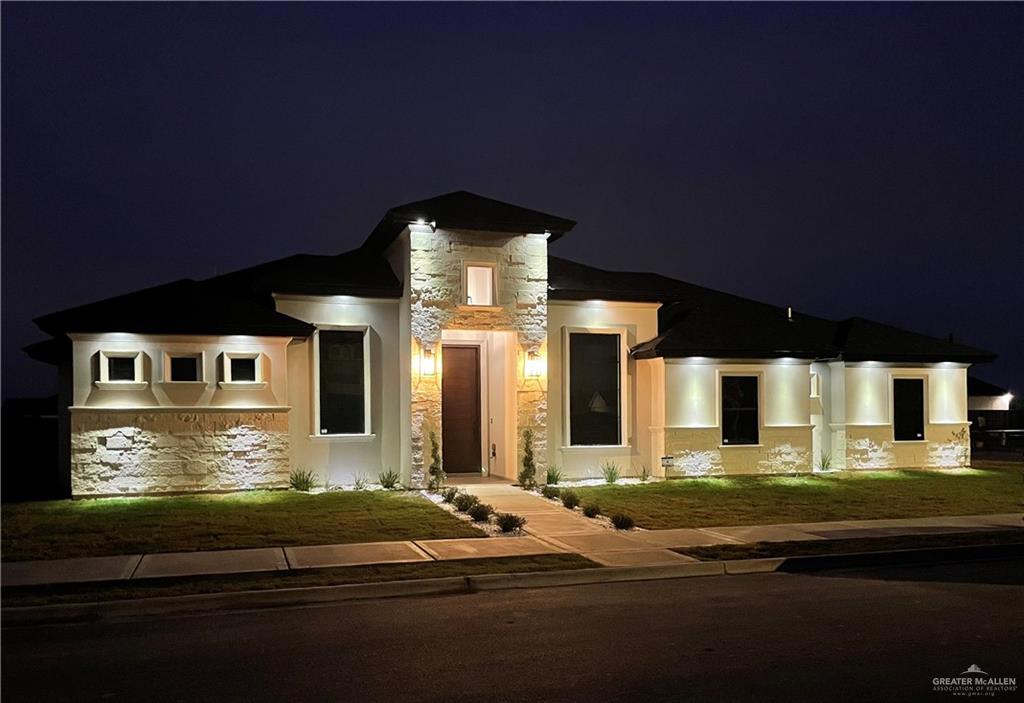 a front view of a house with yard