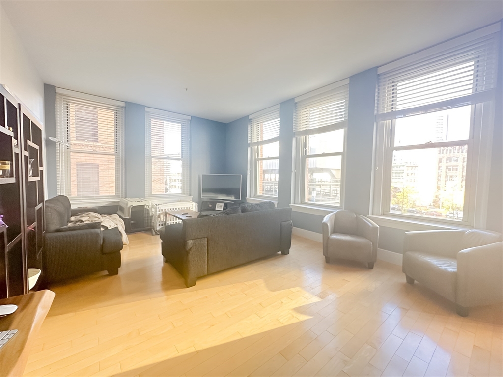 a living room with furniture and windows