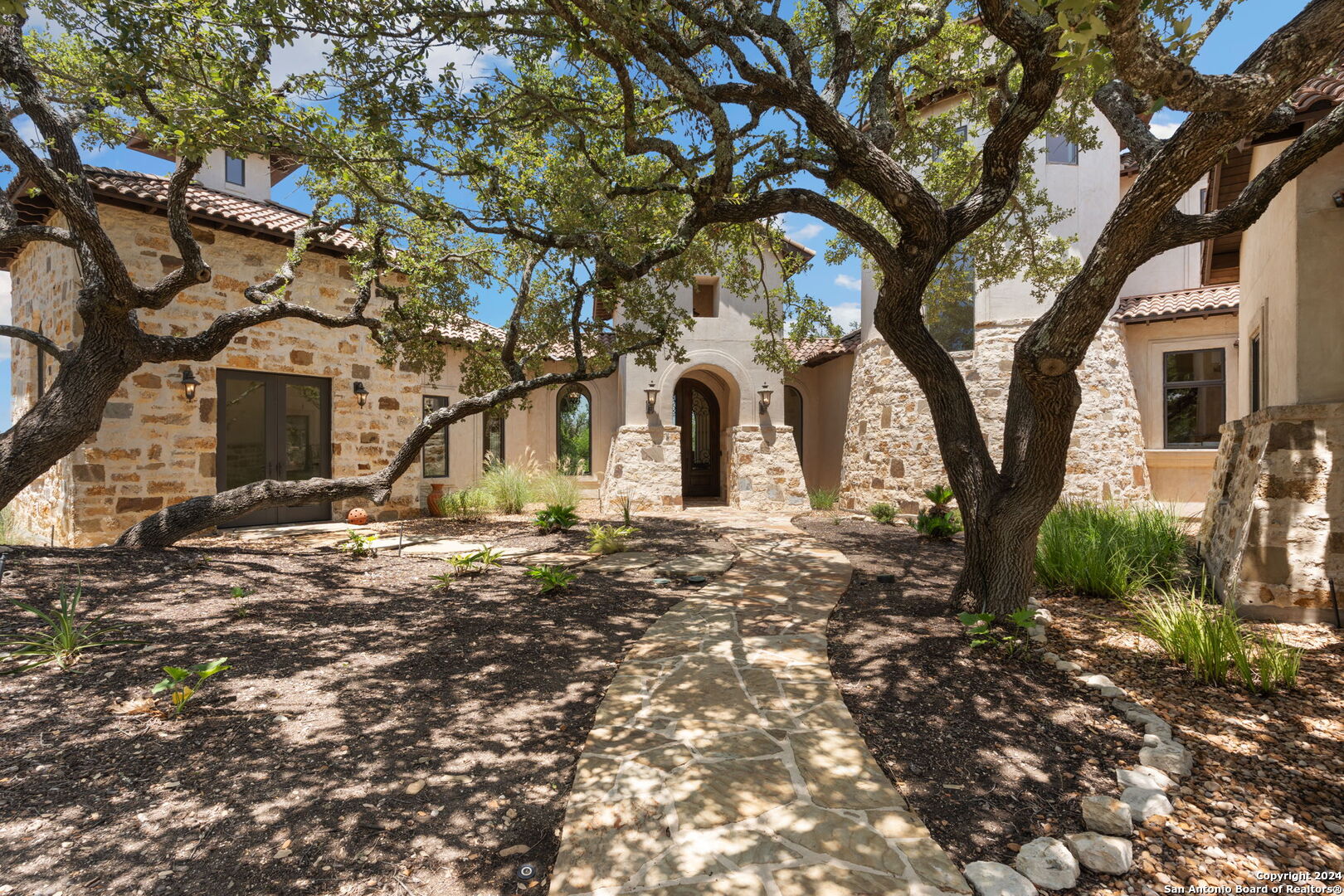 a view of a house with a tree