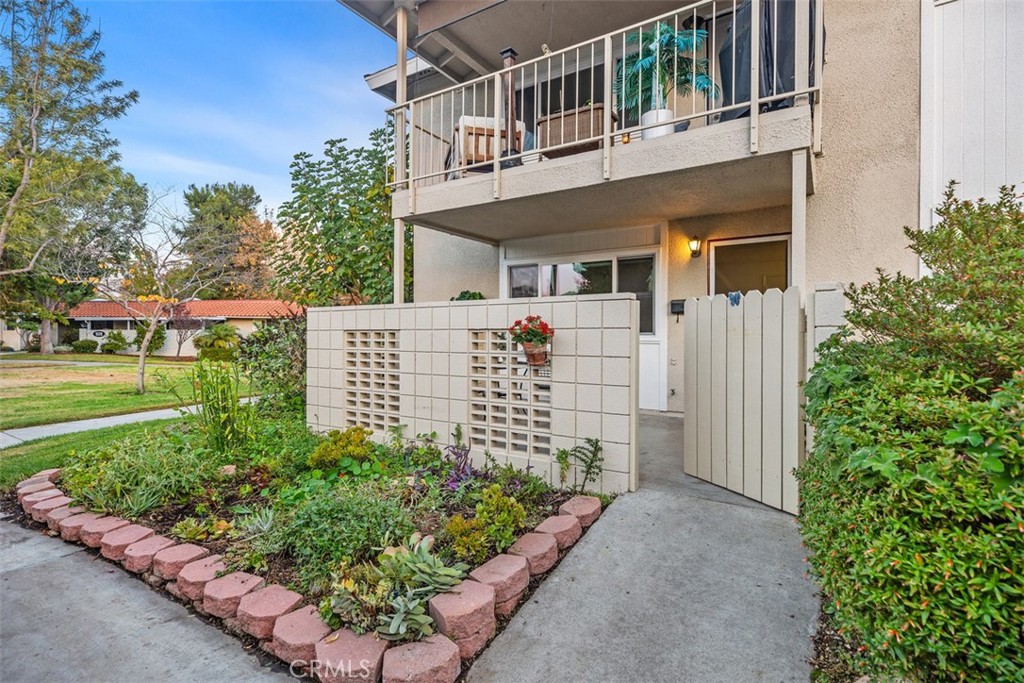 Sunny corner end unit overlooking greenbelt near to creek.  Pretty plantings in front.