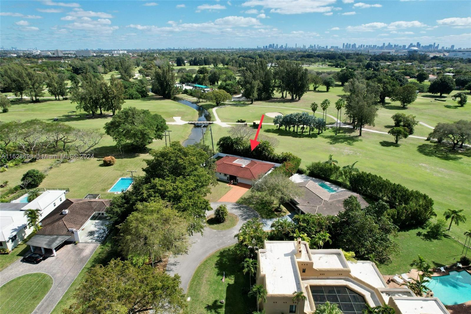 an aerial view of house with yard swimming pool and outdoor seating