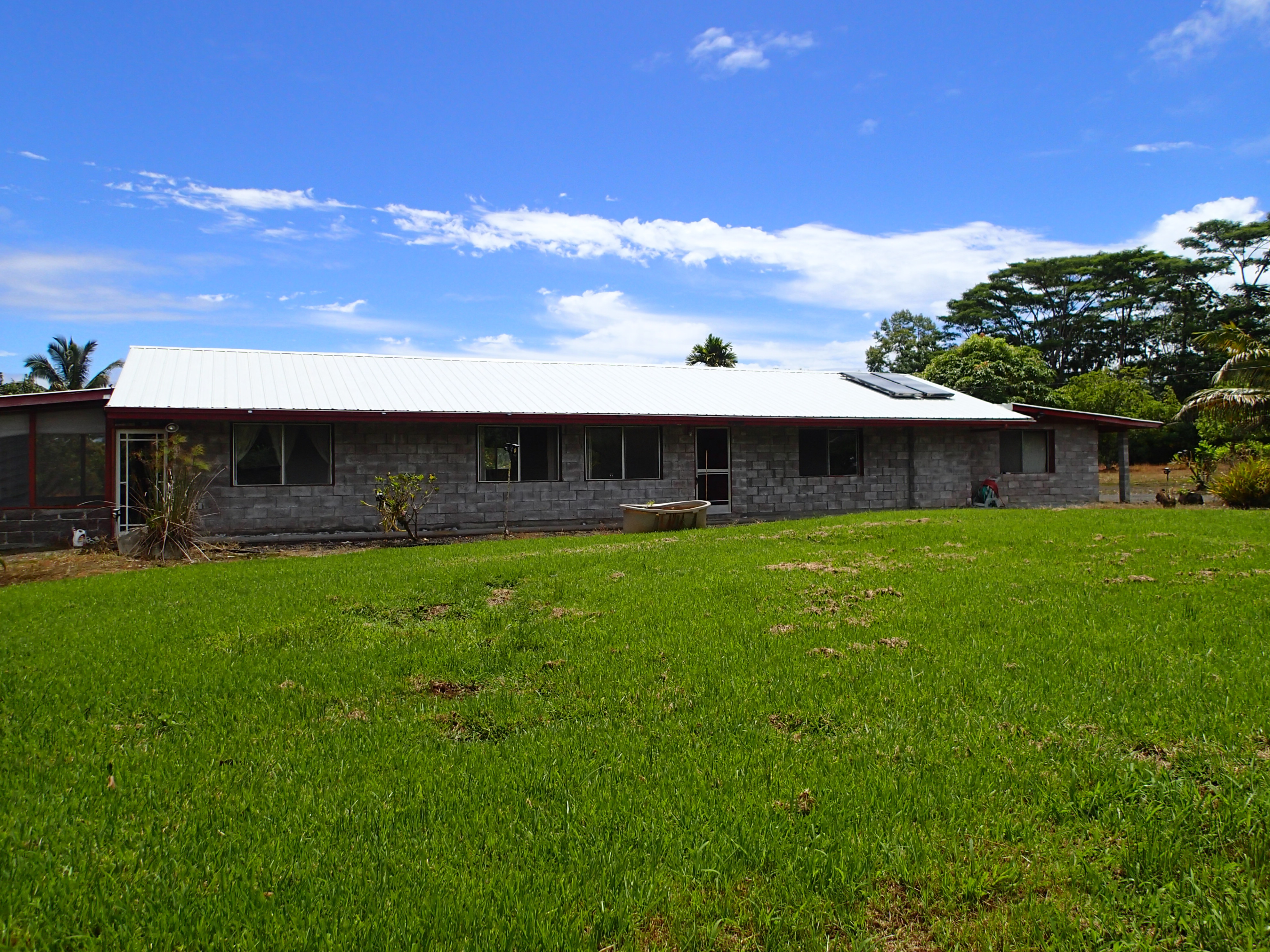 a front view of house with yard and seating