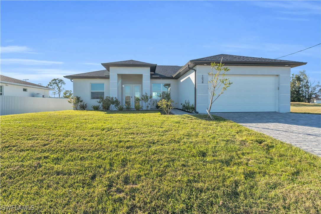 a view of a house with a yard