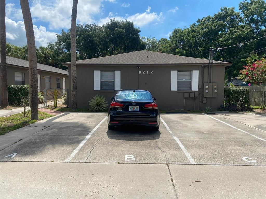 a car parked in front of a house