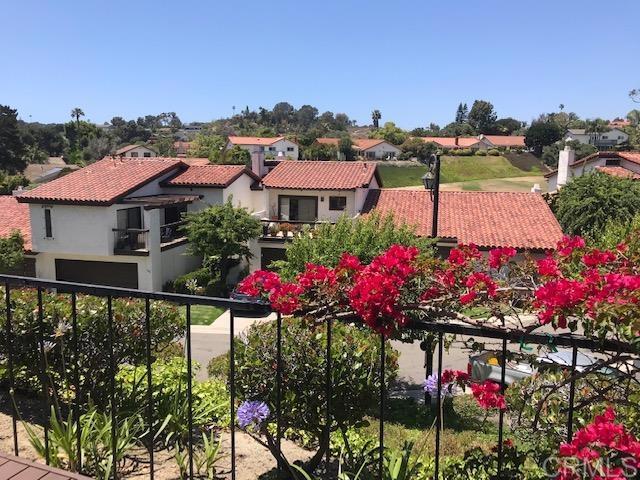 a view of a house with a lot of flower plants