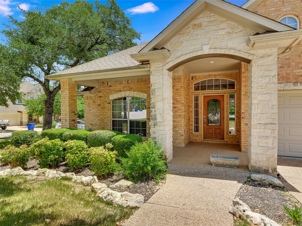 This spacious covered front porch has room to sit and enjoy the neighborhood.