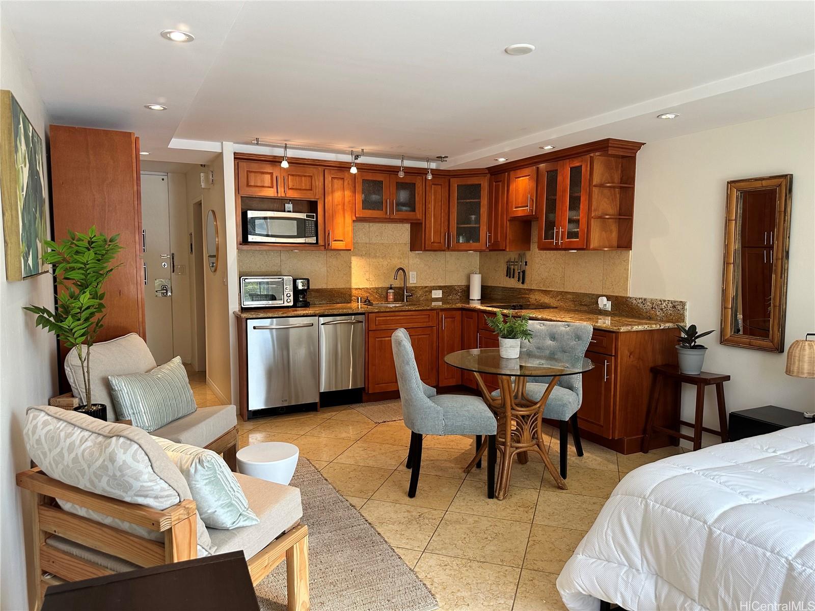 a dining room with a sink table and chairs