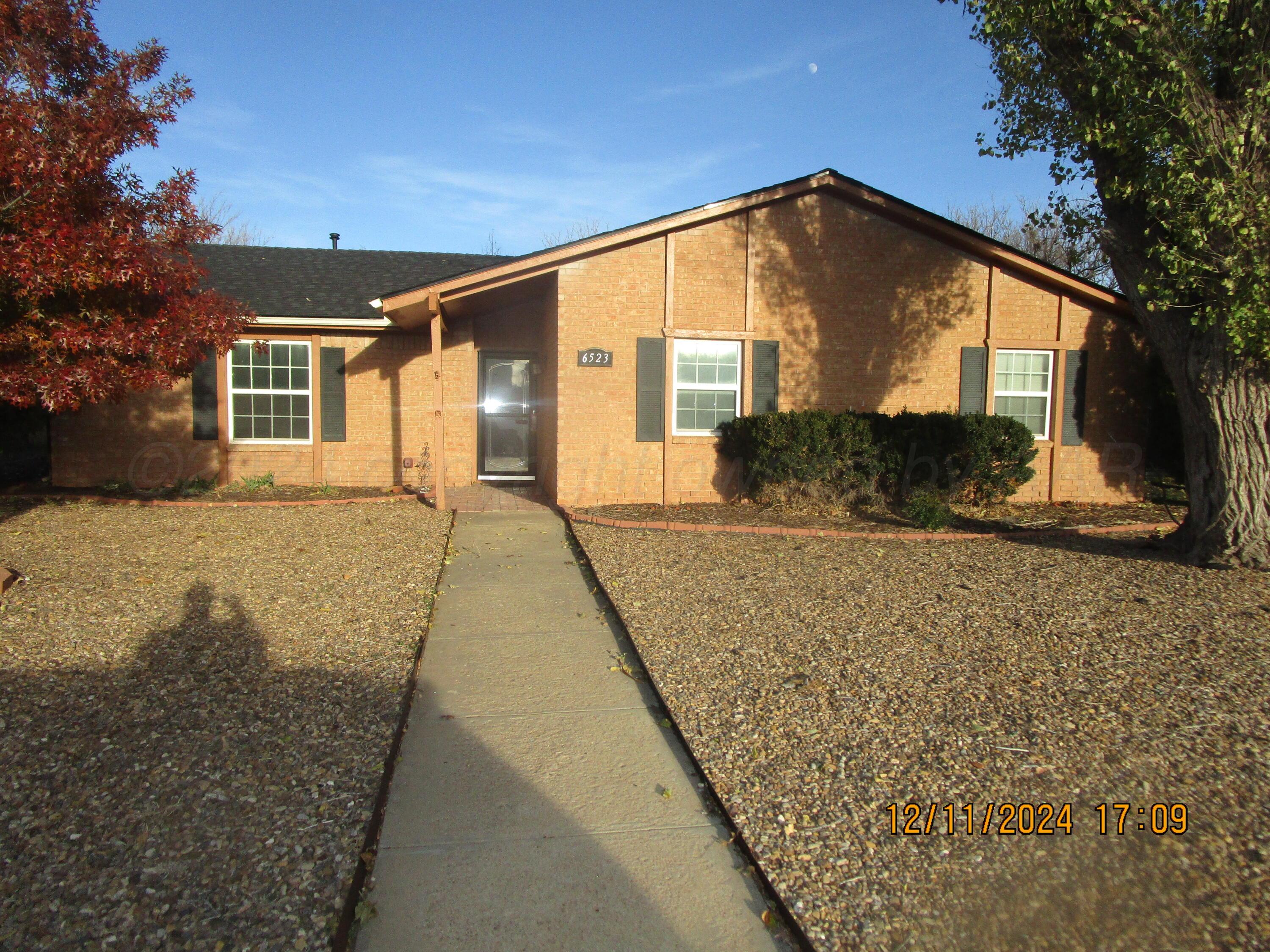 a front view of house with yard