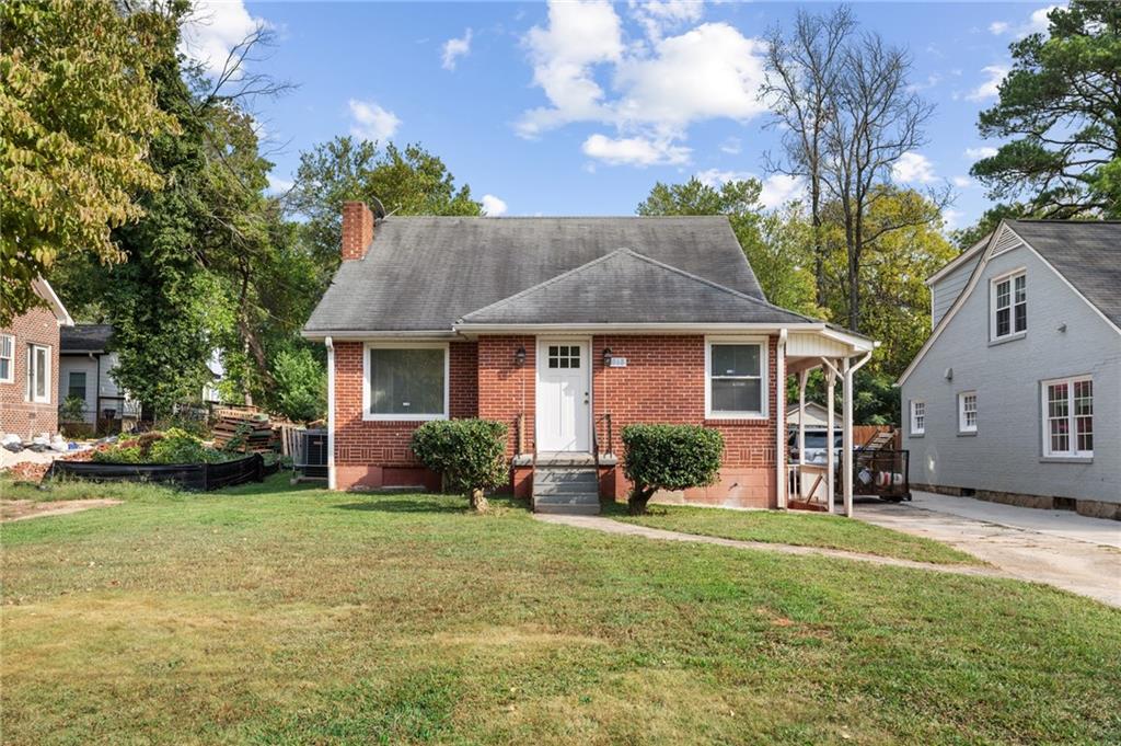 a front view of a house with a garden and porch