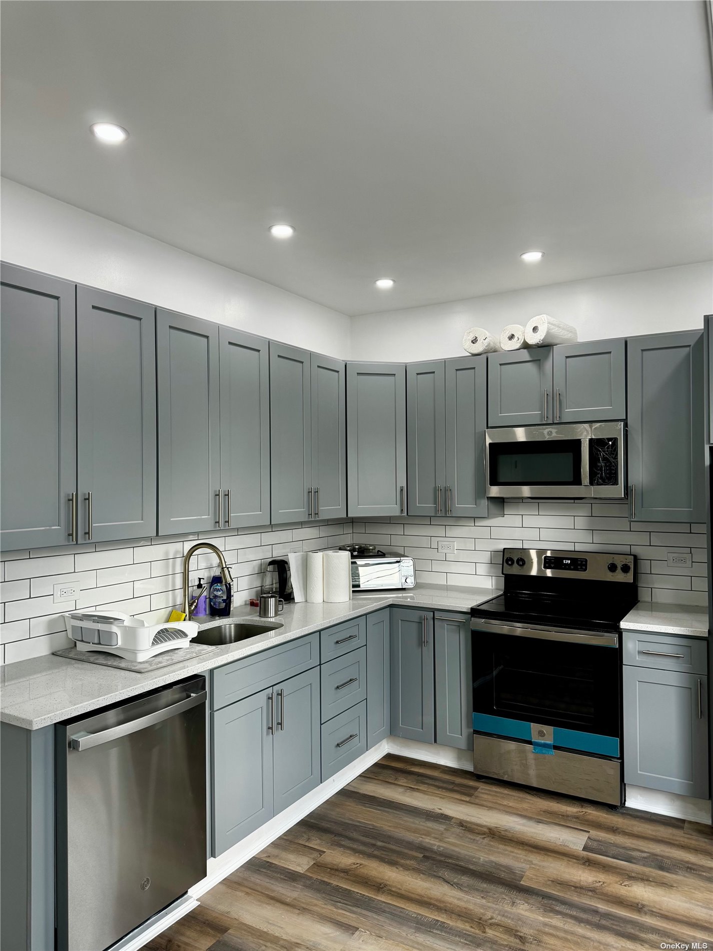 a kitchen with a sink and cabinets