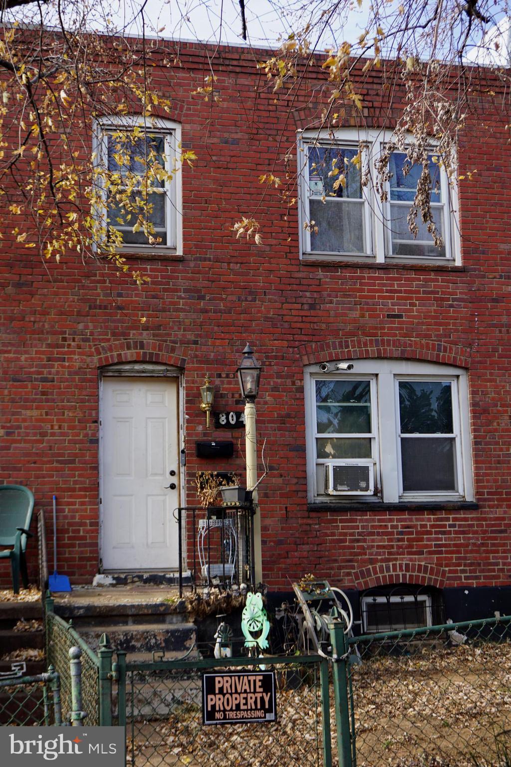 a front view of a house with barbeque area