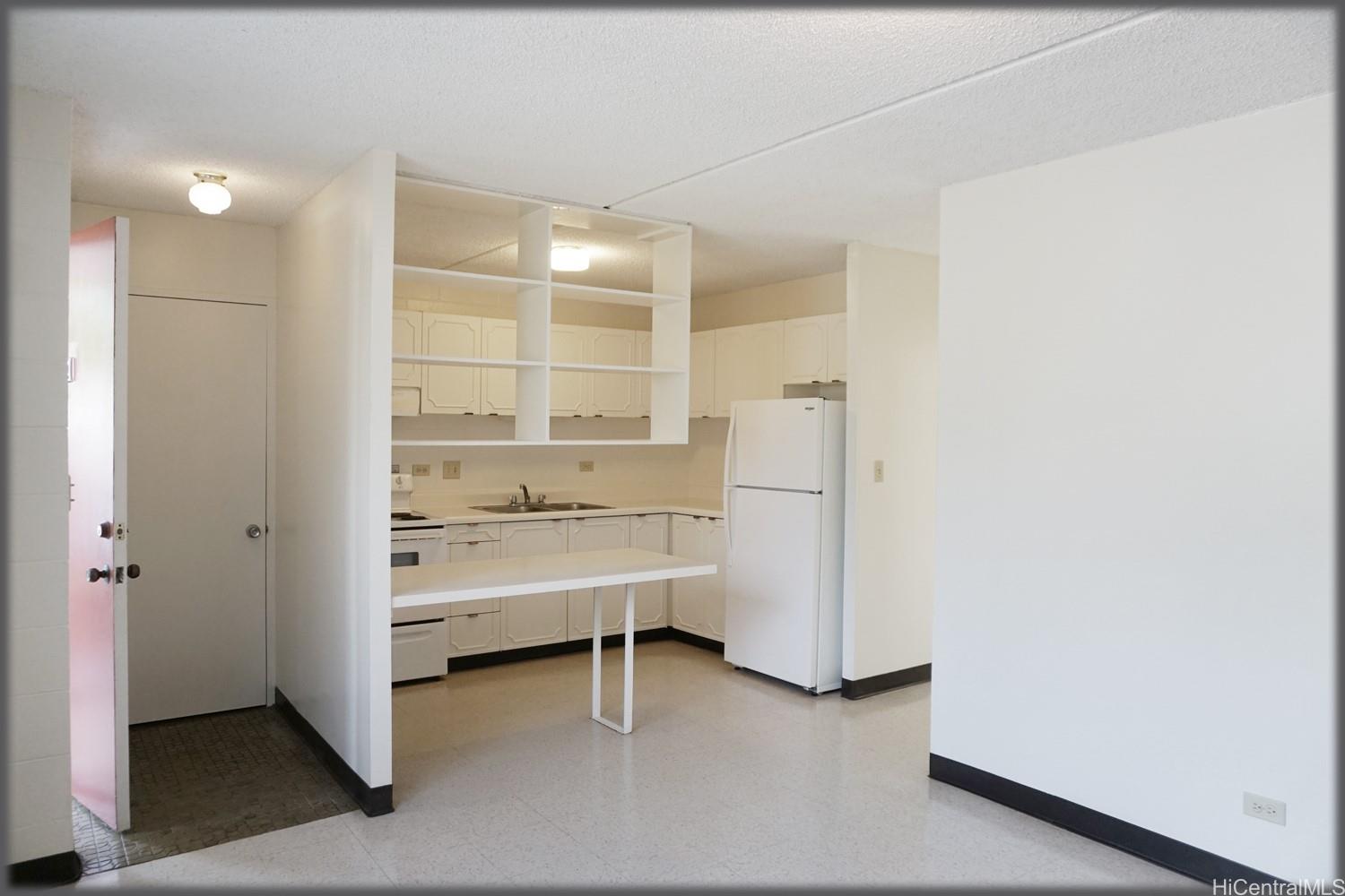 a view of a walk in closet and windows