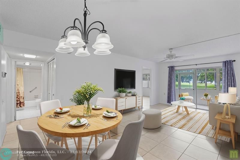 a living room with furniture a chandelier and a dining table