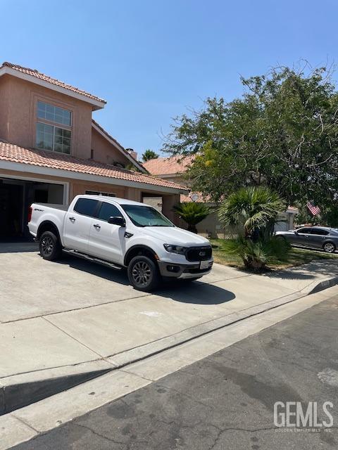 a view of a car parked in front of a house