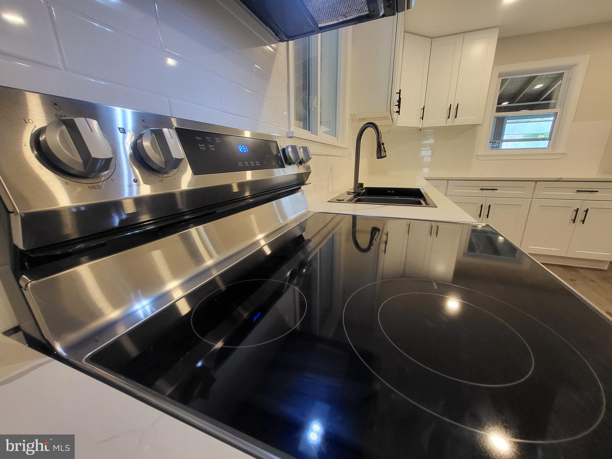 a kitchen with a stove and a sink