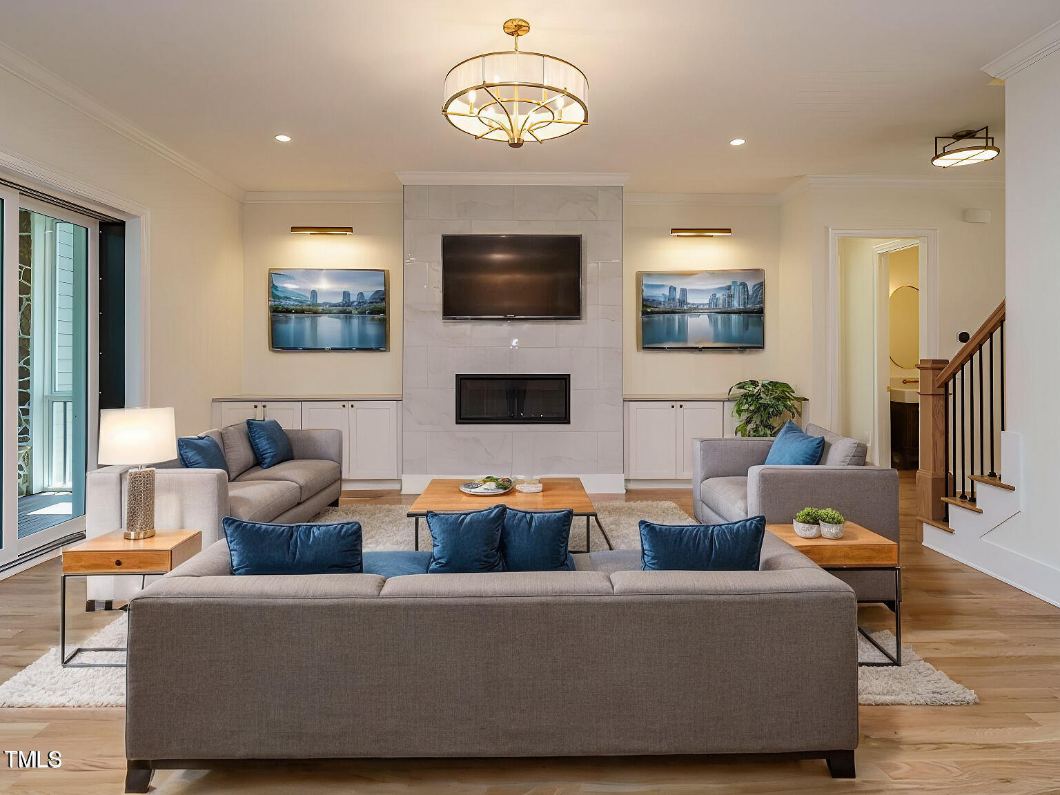 a living room with fireplace furniture and a flat screen tv