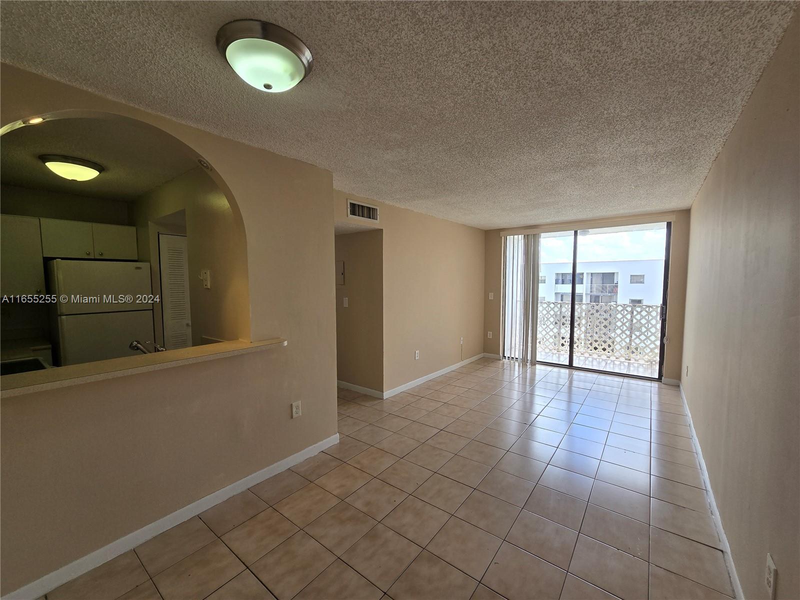 a view of an empty room and window