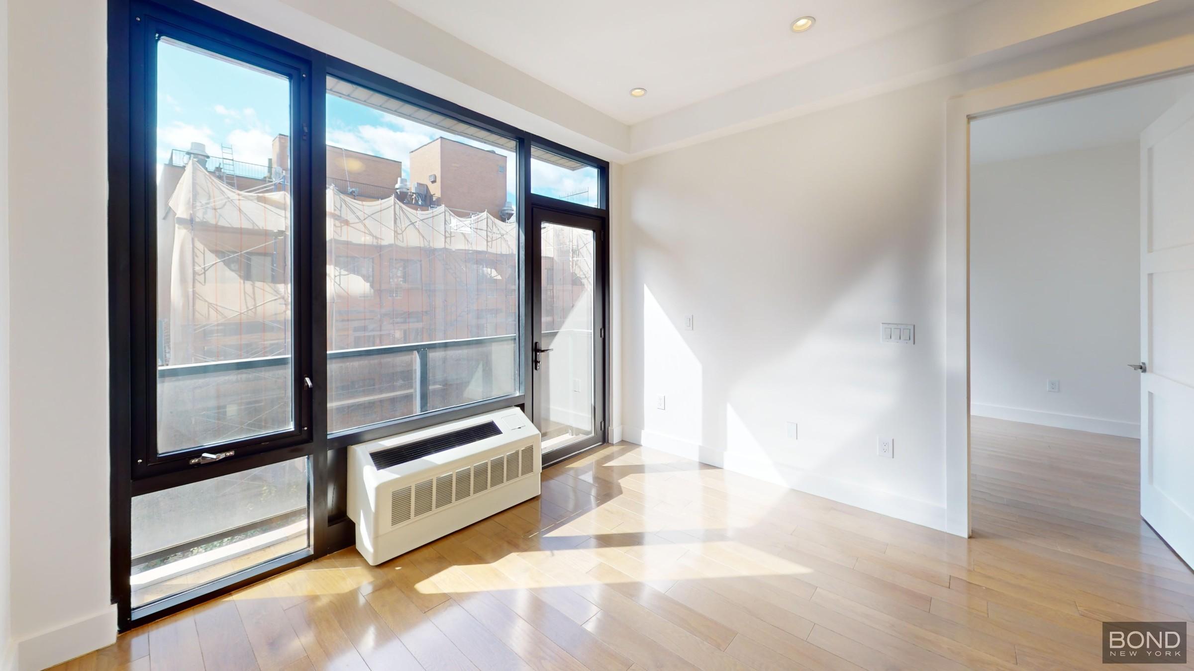 a view of an empty room and window