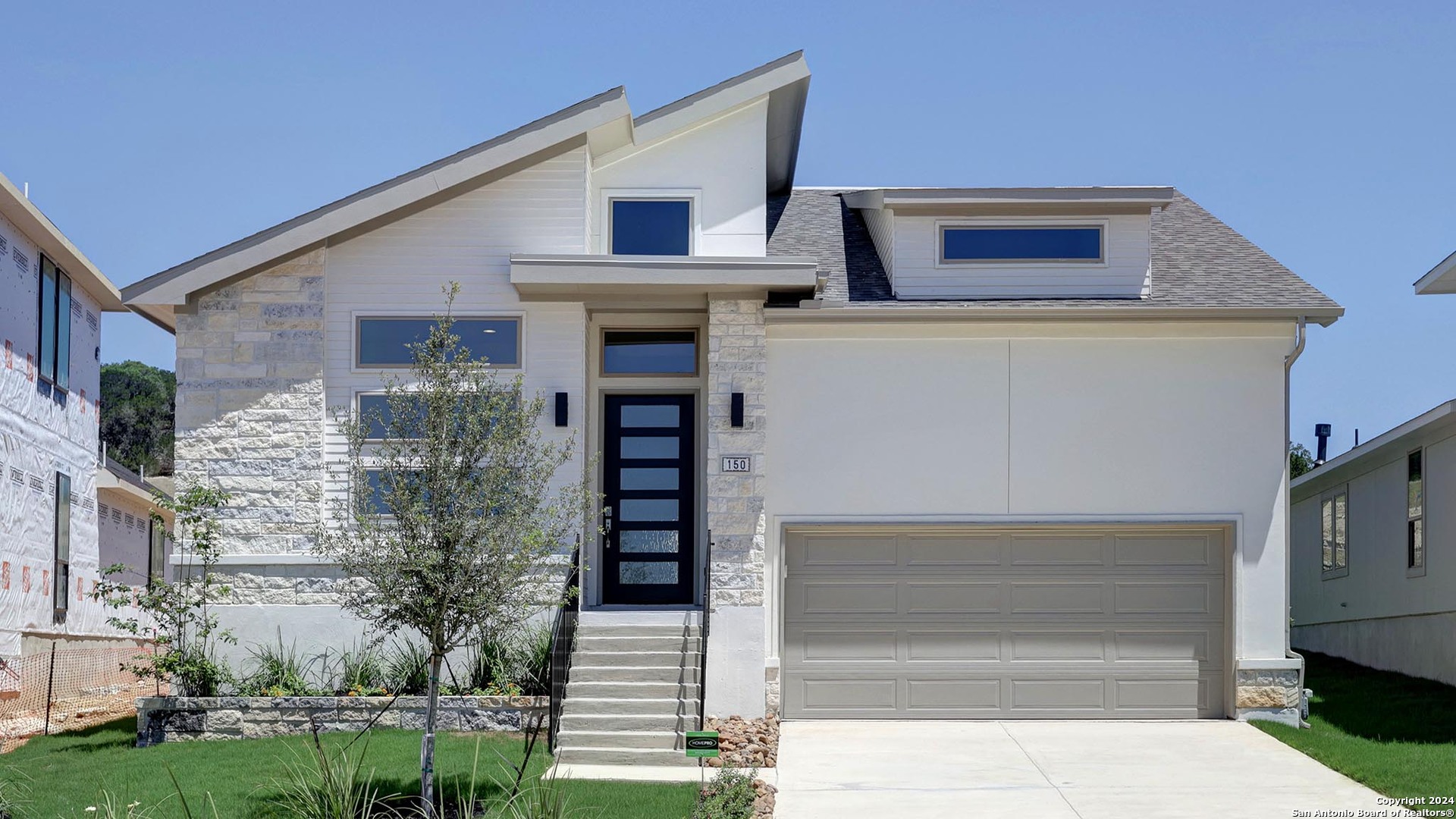 a front view of a house with a garage