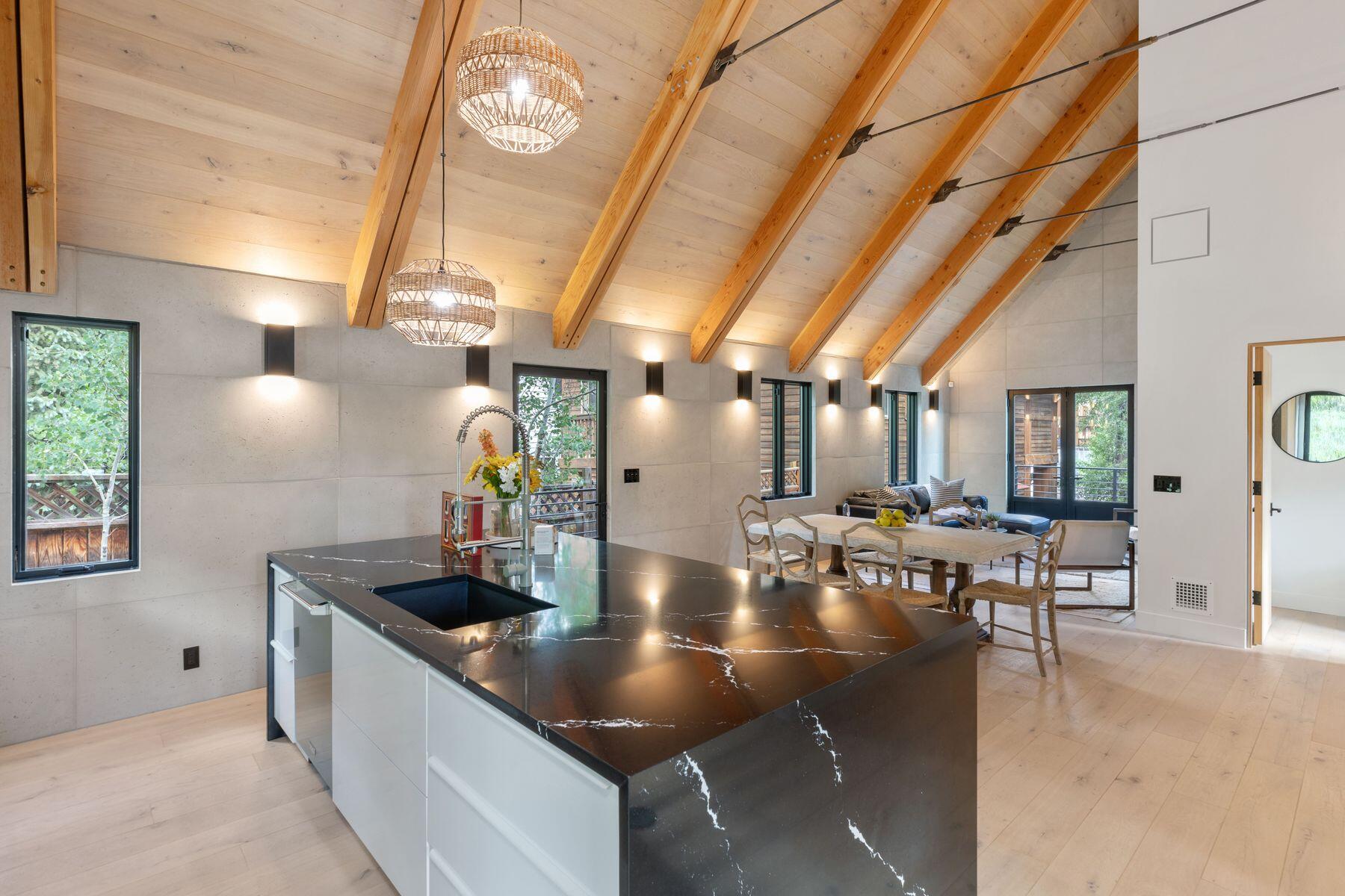 a kitchen with stainless steel appliances granite countertop a sink and cabinets