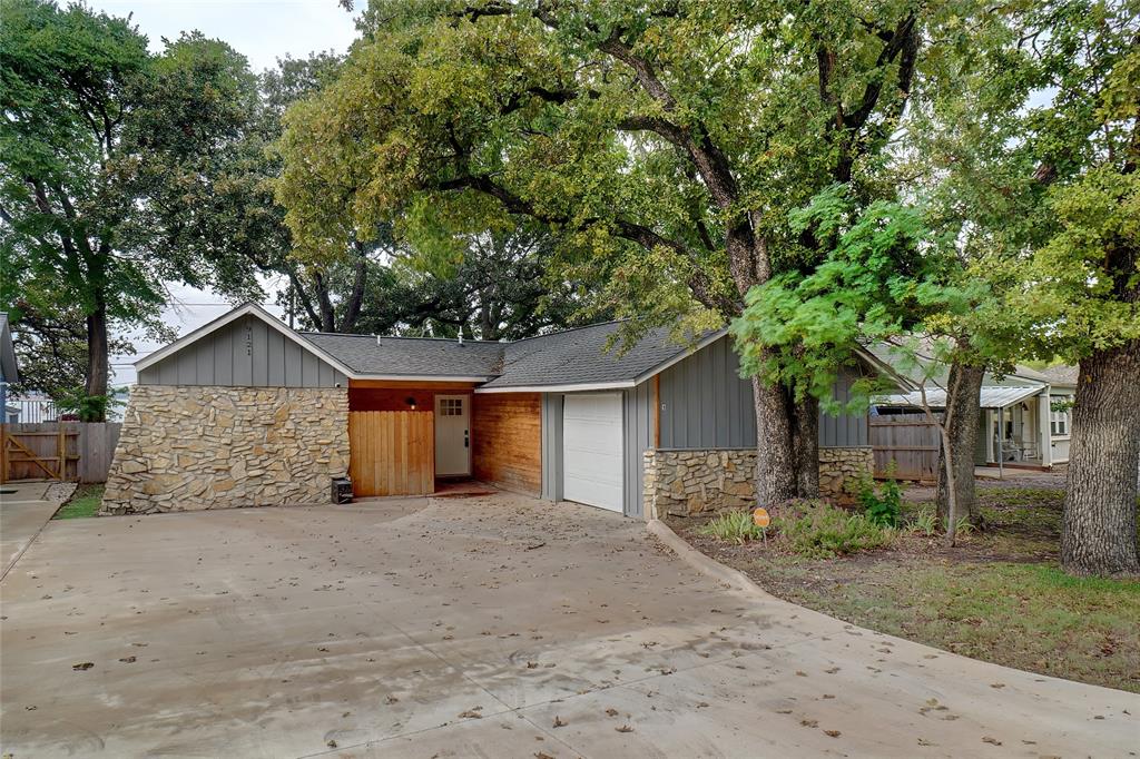 front view of a house with a tree