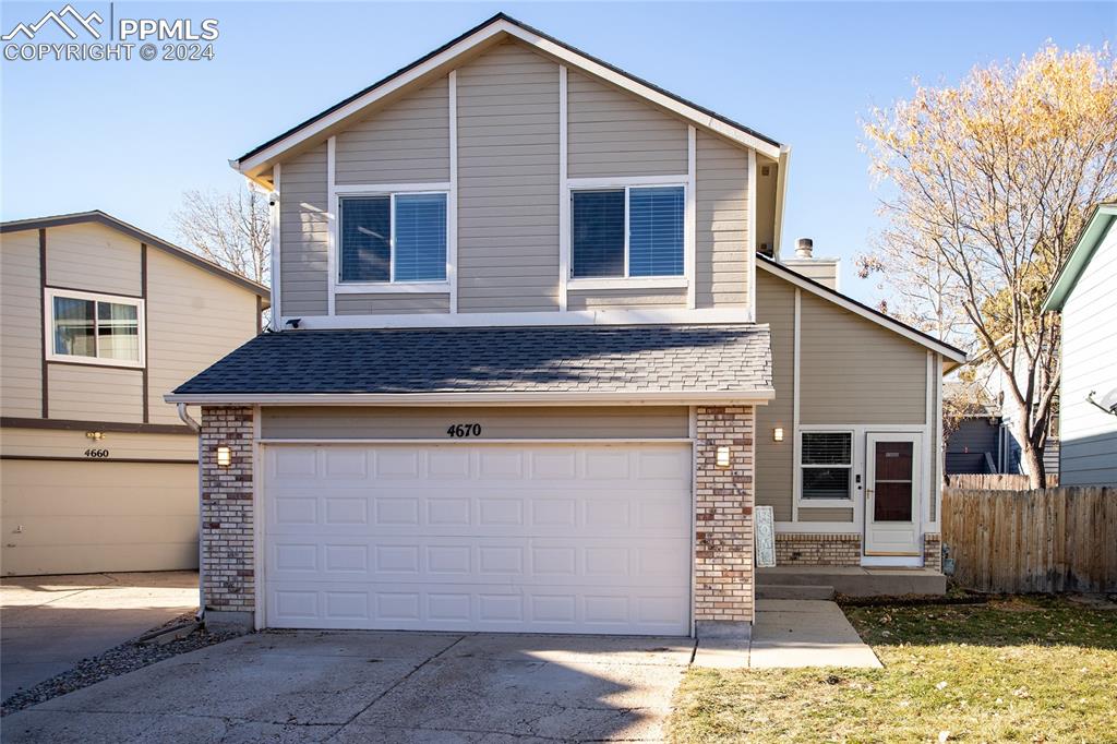 View of property featuring a 2 car garage