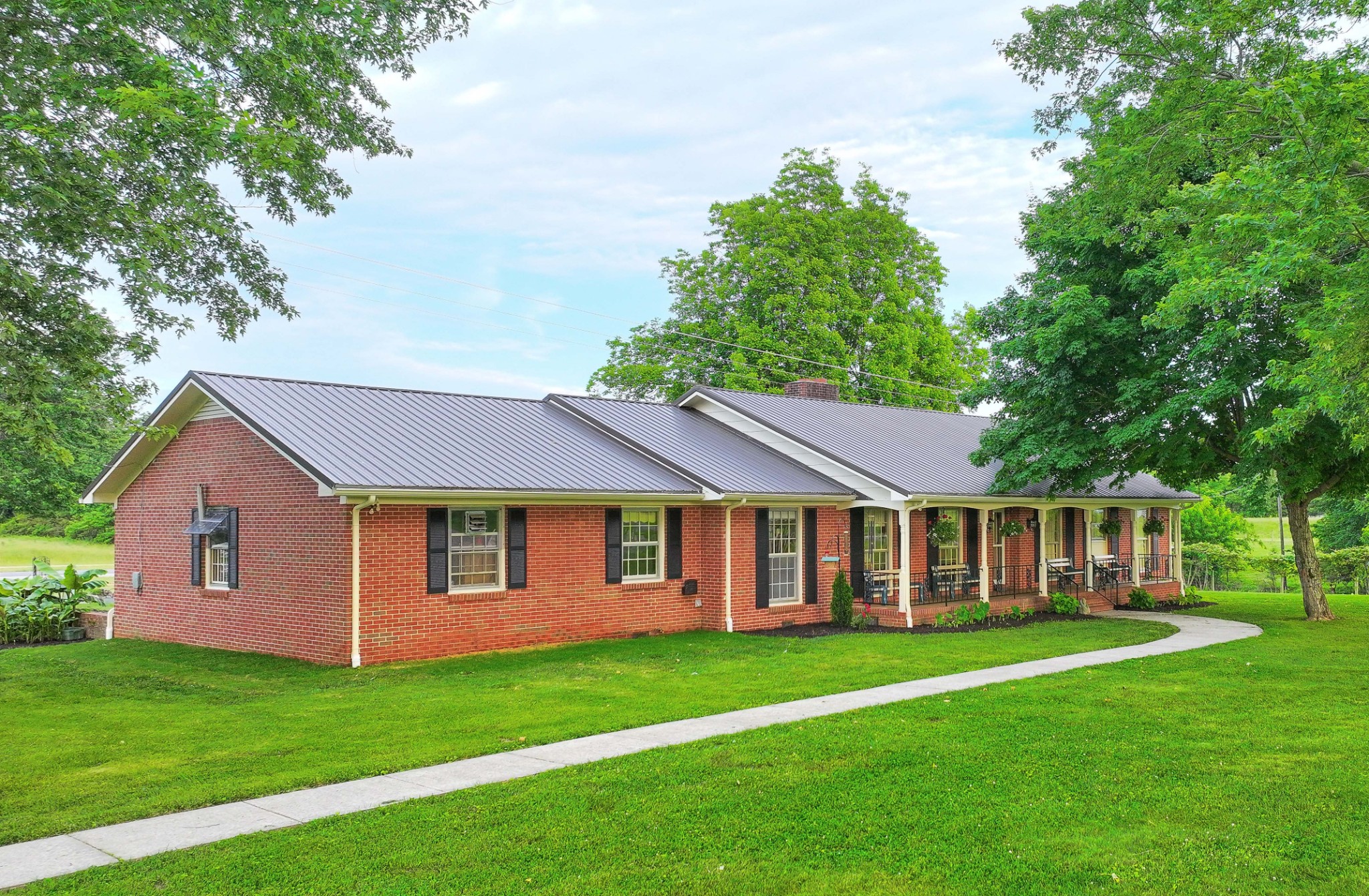 a view of a yard in front of a house with green space