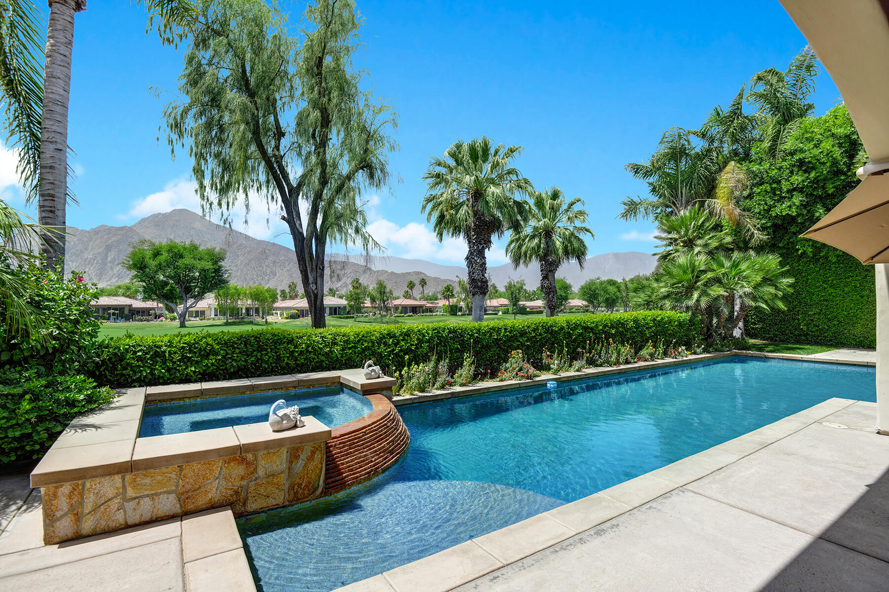 a view of swimming pool with a garden