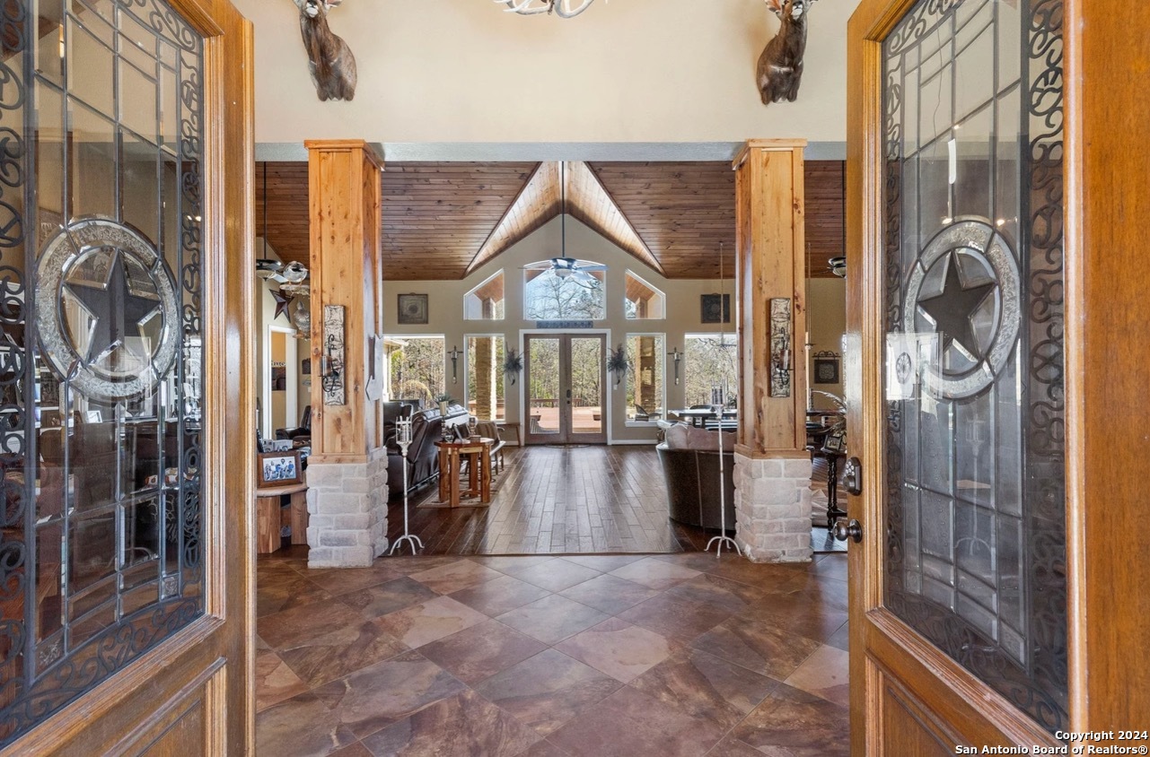 a view of an entryway with wooden floor