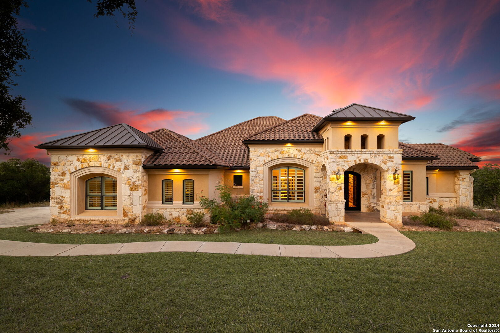 a front view of a house with a yard