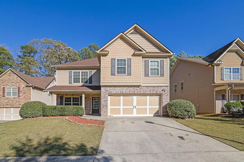 a front view of a house having yard