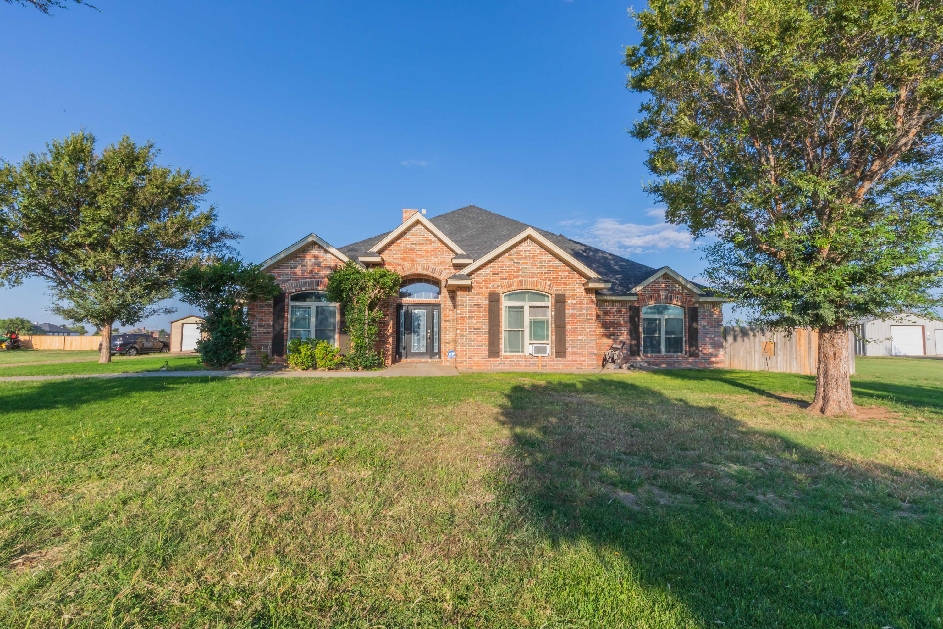 a view of a front of house with a yard