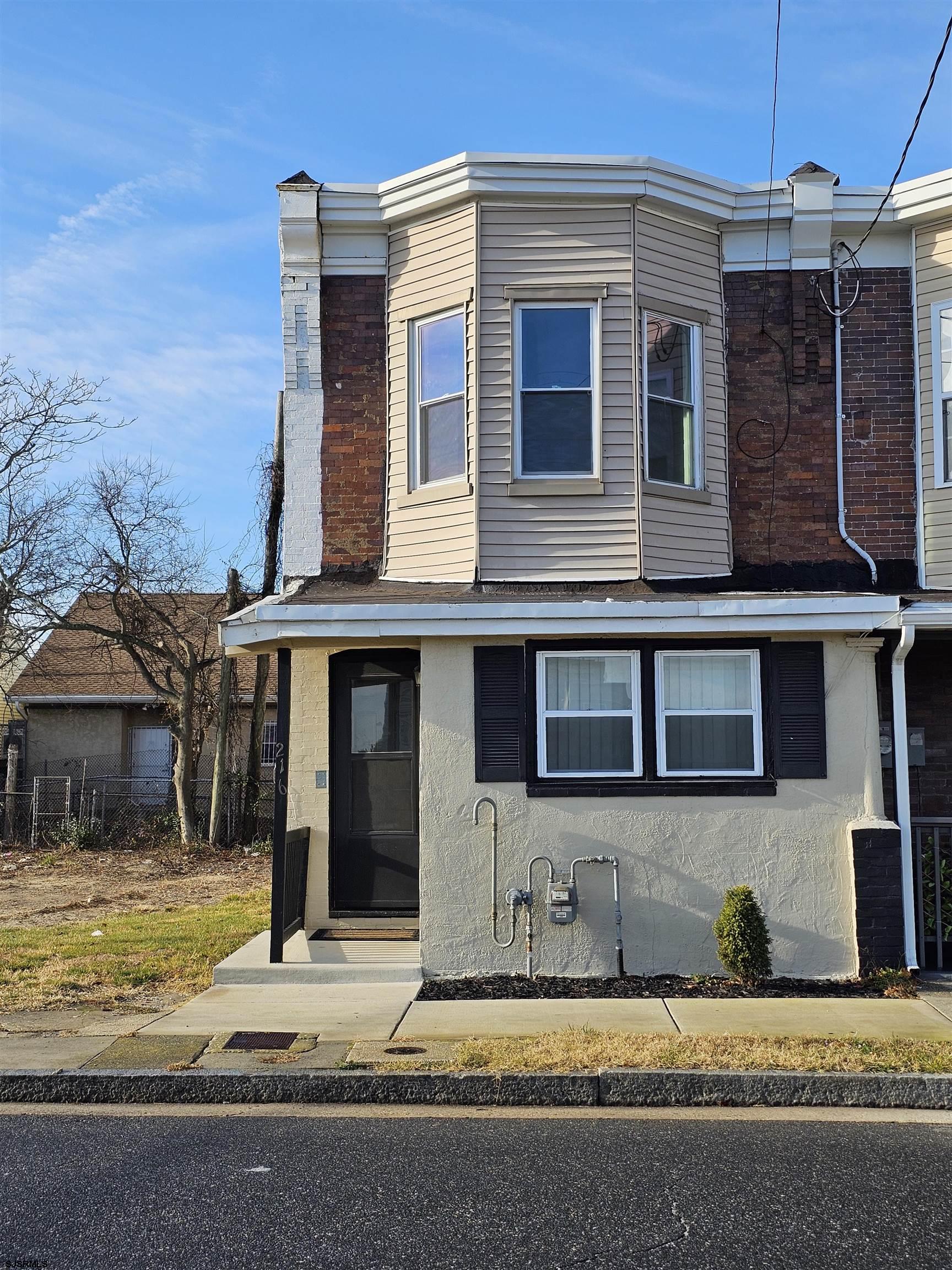 a house that has a large window in front of it