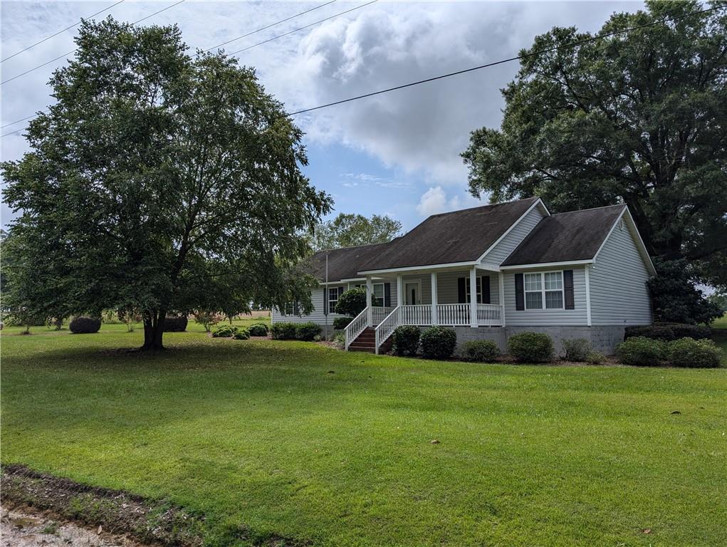 a view of a house with a big yard