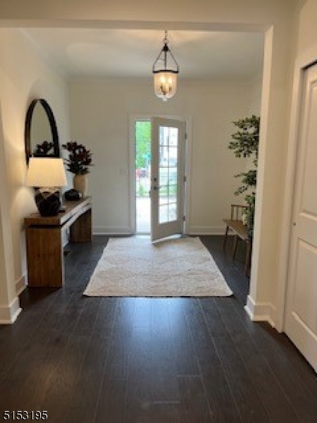 a view of a bedroom with furniture and window