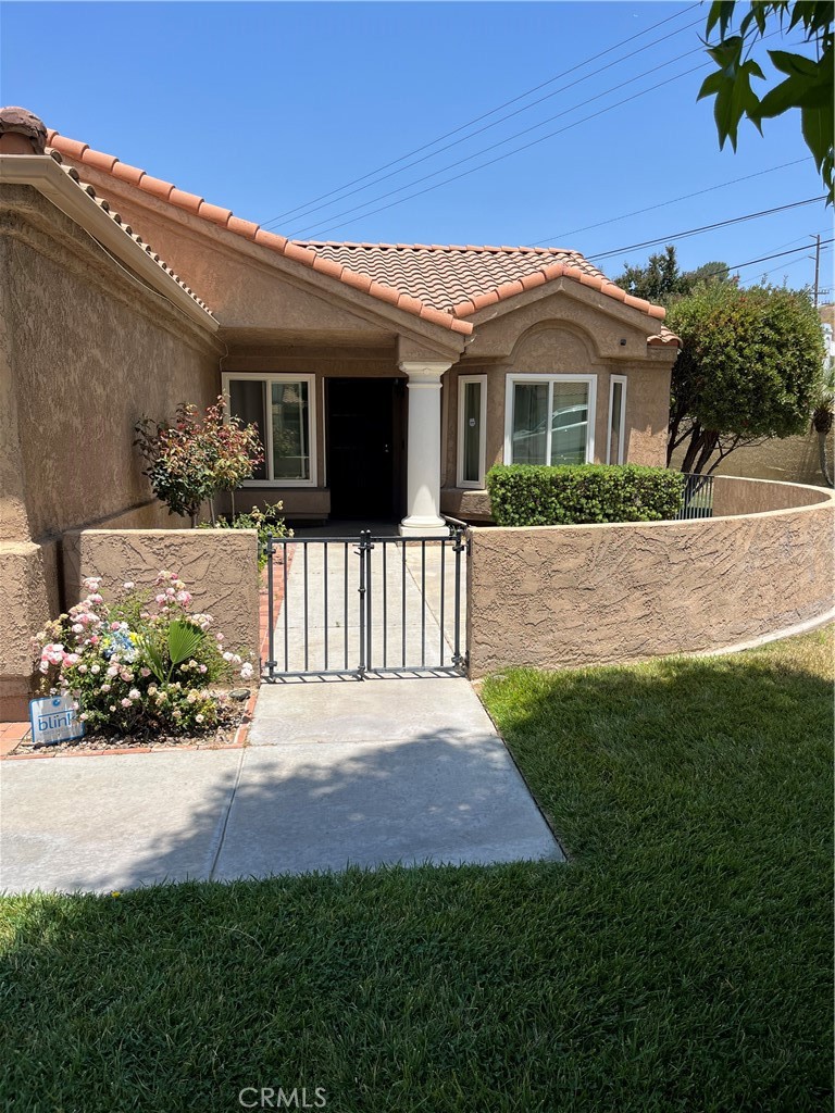 a front view of a house with a yard and porch